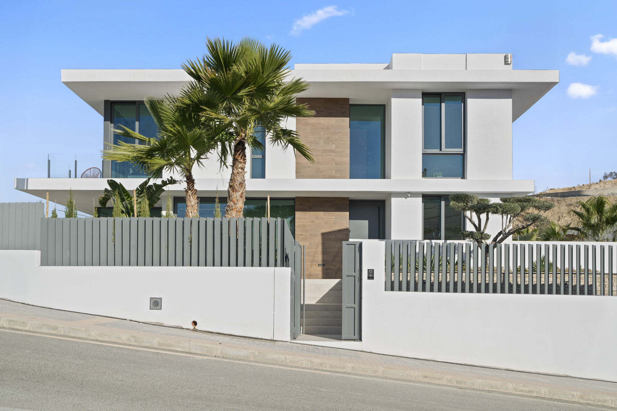 Villa 26 5 Villa 26 front elevation with palm-lined entrance, Villas de Loix