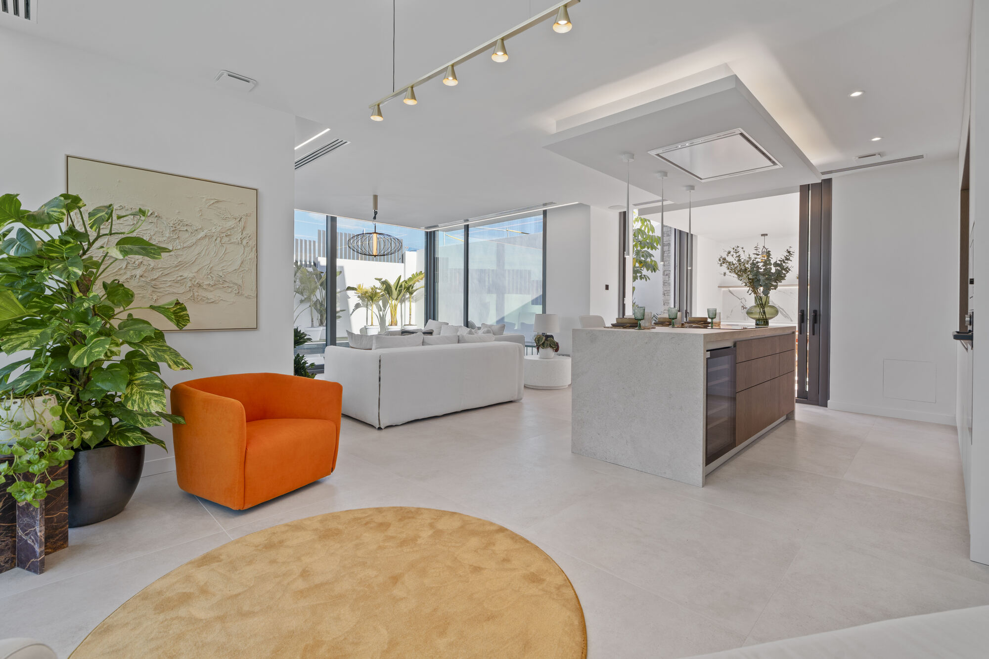 Best Luxury New-Build Developments on the Costa Blanca (2026) 2 Open-plan living room and kitchen island in the Villa 26 show villa at Villas de Loix, Benidorm
