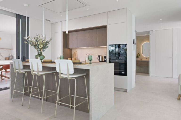 Best Luxury New-Build Developments on the Costa Blanca (2026) 6 Kitchen island with bar stools and built-in ovens in the Villa 26 show villa