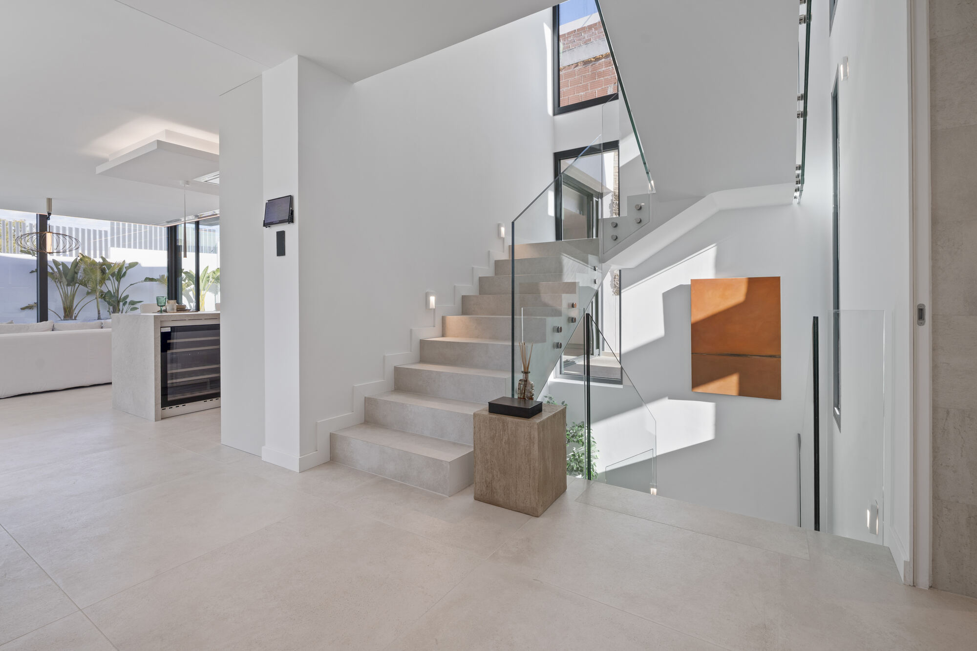 Villa 26 9 Glass-balustraded staircase in the entrance hall at Villa 26