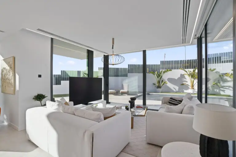 Best Luxury New-Build Developments on the Costa Blanca (2026) 8 Living room with sofas and sliding glass doors to the terrace at Villa 26