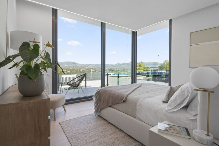 Best Luxury New-Build Developments on the Costa Blanca (2026) 9 Bedroom with full-height windows and views of the Sierra Helada at Villa 26